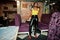 Stunning African American women in yellow top and black leather pants pose at pub