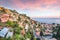 Stunning Aquamarine blue waters of sea and fantastic cityscape of Taormina during sunset