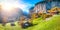 Stunning autumn landscape of  alpine village Lauterbrunnen with famous church and Staubbach waterfall