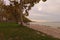 Stunning autumn landscape view of beautiful Lake Balaton during sunset. Plane trees alley is famous touristic place