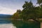 Stunning autumn nature landscape of Bled Lake. Ancient Castle on the top of the rock. Beautiful mountains at the background.