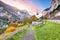 Stunning autumn view of Lauterbrunnen village with awasome Staubbach waterfall and Swiss Alps in the background