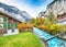 Stunning autumn view of Lauterbrunnen village with awesome waterfall  Staubbach  and Swiss Alps in the background