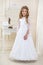 Stunning beauty young girl model in the white communion dress