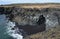 Stunning Black Sand Beach with Basalt Columns and Cavern