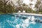 Stunning blue tiled infinity swimming pool in Australian bush se