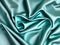 Stunning bright green blue satin silk surface, soft folds on a glossy surface.