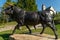 Stunning bronze bull statue against the bright blue sky in Magdalensberg, Carinthia, Austria