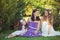 Stunning Brunette blond chestnut blue eyes sisters girls wearing stylish white purple dress enjoying life time together summer sun