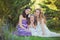 Stunning Brunette blond chestnut blue eyes sisters girls wearing stylish white purple dress enjoying life time together summer sun