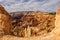 The stunning Bryce Canyon in all its glory taken from between two sandstone hoodoos with more amazing hoodoos in the distance with