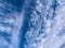 Stunning cirrus cloud formation panorama in a deep blue sky