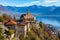 Stunning close up panorama view of Madonna del Sasso church above Locarno city with Lake Maggiore, snow covered Swiss Alps