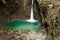 Stunning close up of turquoise waterfall kozjak in canyon, slovenia