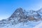 Stunning close up view of Eiger north face from Kleine Scheidegg on a winter sunny day, famous mountain of Swiss Alps on Bernese