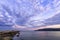 stunning clouds over the sea bay and pier