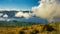 Stunning cloudy views of the bays of Lake Wanaka and the snow capped Southern Alps from the Roys Peak mountain track