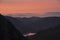 Stunning colorful landscape image of view down Honister Pass to Buttermere from Dale Head in Lake District during Autumn sunset