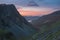 Stunning colorful landscape image of view down Honister Pass to Buttermere from Dale Head in Lake District during Autumn sunset