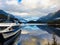 stunning crystal clear reflections on the surface of Lake Manapouri with the cruise ship in the commercial dock