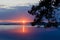 Stunning dawn at sea, boat in the distance