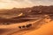 A stunning desert landscape image featuring the golden dunes of the nearby Sahara Desert, with a camel caravan in the distance,