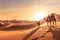 A stunning desert landscape image featuring the golden dunes of the nearby Sahara Desert, with a camel caravan in the distance,