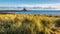 Stunning dramatic landscape image of Lindisfarne, Holy Island in Northumberland England during Winter
