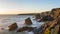 Stunning dusk sunset landscape image of Bedruthan Steps on West