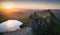 Stunning early sunrise on the summit of helvellyn with first light and lone hiker