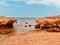 Stunning Egyptian beachscape with large rocks jutting out of the ocean on a backdrop of sandy beach