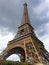 Stunning Eiffel Tower view with dark clouds. Closeup capture aiming to show different aspect of Eiffel tower in bad wheather