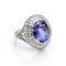 Stunning engagement ring composed of a dazzling tanzanite gemstone accented with sparkling diamonds.