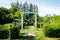 Stunning Entrance Portico Gate classic style decoration of a Public Garden. Column Stone structure element in classic architecture