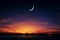 A stunning evening sky with crescent moon, star, and Arabic text
