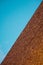 Stunning exterior view of a classic building with red bricks, set against a beautiful sky backdrop