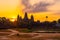 Stunning fiery sunrise at Angkor Wat temple in the morning with orange light and moving cloud