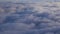 Stunning footage of aerial view above clouds from airplane