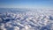 Stunning footage of aerial view above clouds from airplane