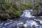 Stunning Frozen Hassafallen Waterfall in Wintry Rural Woodlands