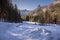 Stunning frozen path and forest in Koscieliska valley in winter