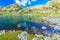 Stunning glacier lake and colorful stones,Retezat mountains,Transylvania,Romania