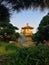 Stunning golden temple in the middle of garden