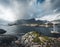 The stunning Hamnoy bridge in Lofoten Islands, Norway seen from a drone aerial. The bridge connects the village of Reine