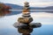 Stunning image of three rocks stacked on sea and clear sky with play of light and shadow