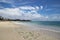 Stunning Indian Ocean paradise beach with turquoise water and bright sky.