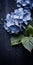 Stunning Japanese Photography: Blue Flowers On Dark Table With Green Leaves