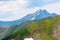 stunning landscape in high mountains of romania. grass and spots of snow on the slopes