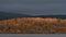 Stunning landscape image across Bassenthwaite Lake in Lake District suring moody stormy Autumn evening