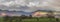 Stunning landscape image across Bassenthwaite Lake in Lake District suring moody stormy Autumn evening